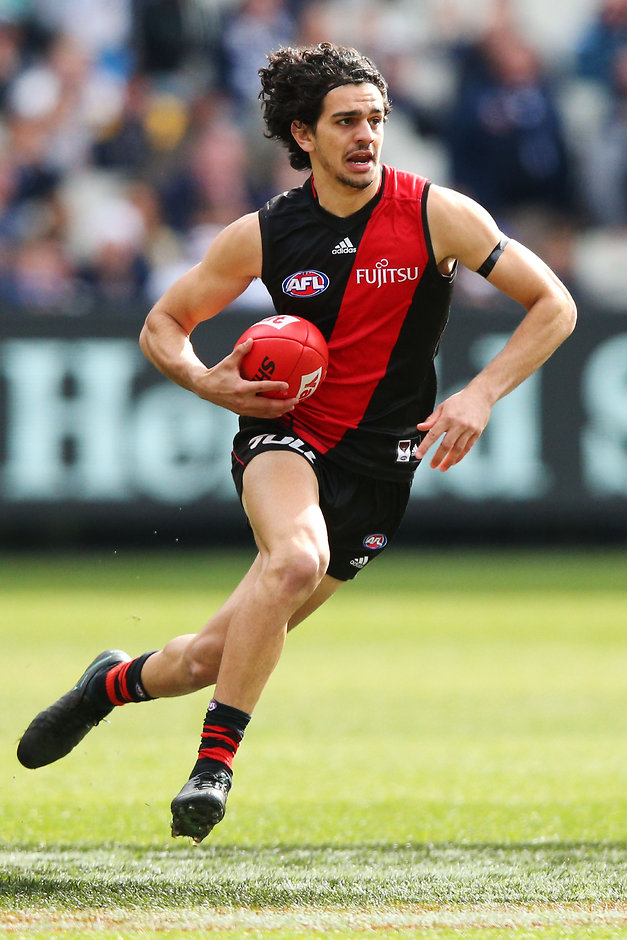 AFL 2016 Rd 23 - Essendon v Carlton MELBOURNE, AUSTRALIA - AUGUST 27: Jake Long of the Bombers runs with the ball during the 2016 AFL Round 23 match between the Essendon Bombers and the Carlton Blues at the Melbourne Cricket Ground on August 27, 2016 in Melbourne, Australia. (Photo by Michael Dodge/AFL Media)